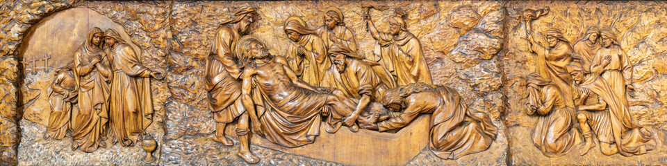 MILAN, ITALY - MARCH 5, 2024: The carved relief  Burial of Jesus  in the church Chiesa di San...