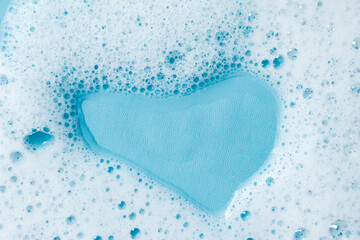 detergent foam isolated on blue background