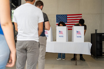 people waiting in line queue for voting registration in the US election polling place