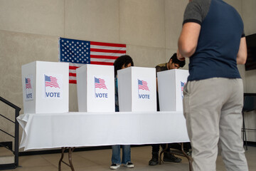 people waiting in line queue for voting registration in the US election polling place