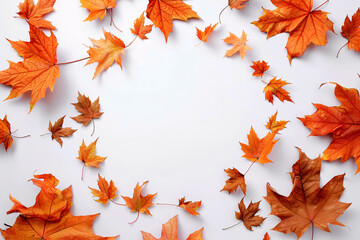Circular frame of autumn orange leaves on a white backdrop perfect for product placement