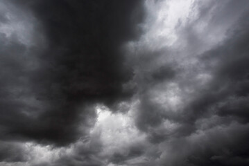 Dramatic dark storm rain clouds black sky background. Dark thunderstorm clouds rainny atmosphere. Meteorology danger windstorm disasters climate. Dark cloudscape storm disaster gloomy gray cloud sky