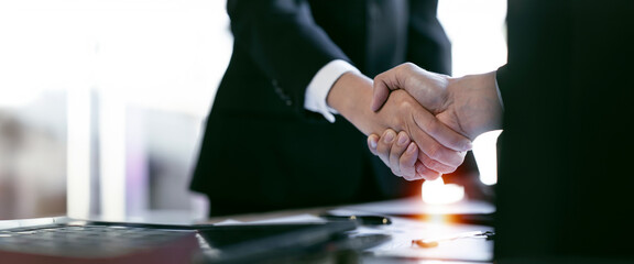 Closeup Businessmen making handshake with partner, greeting, dealing, merger and acquisition,...