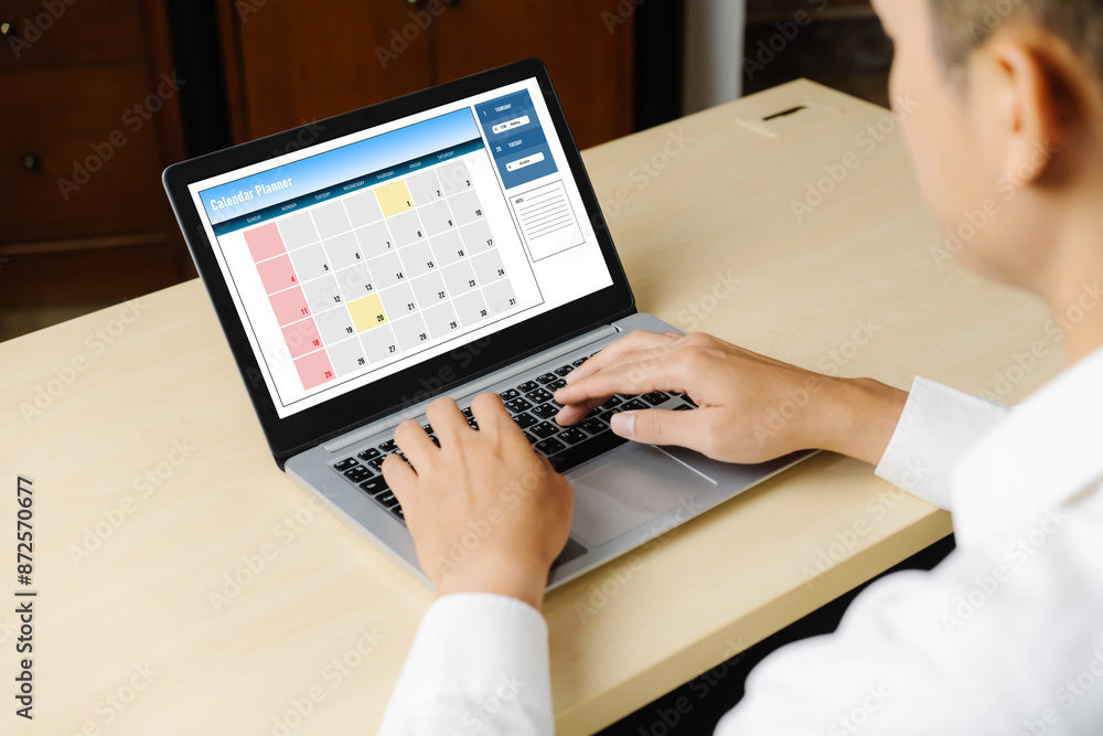 Poster calendar on computer software application for modish schedule planning for personal organizer and on