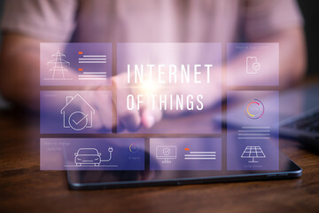 Internet of things, Man using software to control and manage physical object.