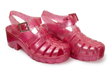 Women's pink sequin sandals on a white background. Women's shoes are isolated.