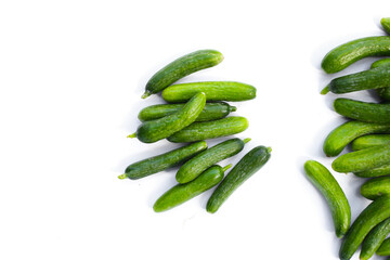 Mini cucumbers on white background.