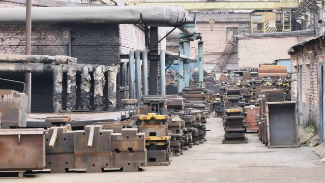 Production site of a metasurgical plant in need of renovation. Dilapidated condition and poor technical state of production. 