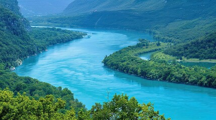 A river with a blue color and green trees in the background