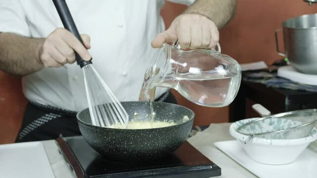 Italian chef cooks Panella Sicilian fritters made of chickpea flour closeup kitchen