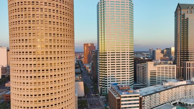 Aerial view of downtown district of Tampa city in Florida, USA. Glass and steel high skyscraper buildings and street with traffic in modern American midtown