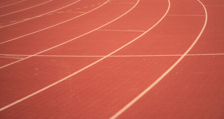 Red running track lines in the stadium.
