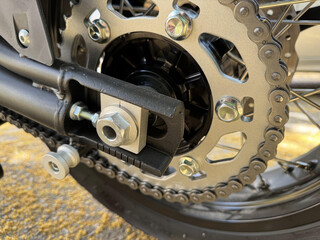 Macro photography of cogwheel of motorbike. Chain ring of motorbike