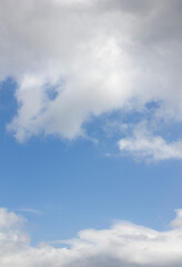 Blue sky and white puffy clouds.