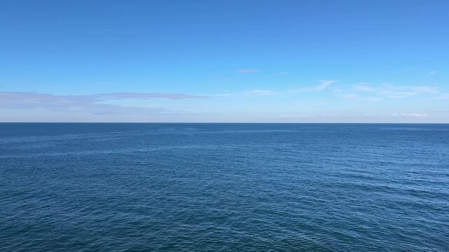 Calm blue ocean water and sky.
