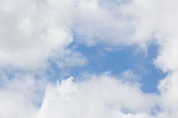 Blue sky and white puffy clouds.