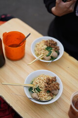 Two bowl of noodle on the white table