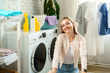 Woman Resting Near Laundry Baskets in a Modern Home