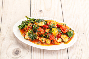 Chicken with tomato and spinach