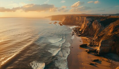 Breathtaking aerial view of a sandy beach with cliffs alongside it, tourist spot, scenic view, sunset