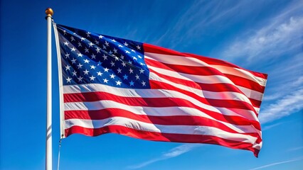 Obraz premium Vibrant American flag proudly waving solitary in a serene, cloudless blue sky, symbolizing freedom and national pride.