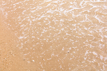 Yellow sand on the seashore as an abstract background. Texture