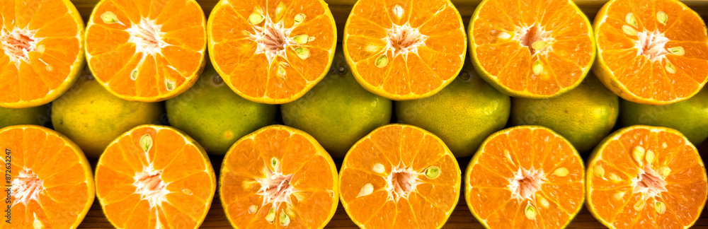 Wall mural fresh juicy oranges as background