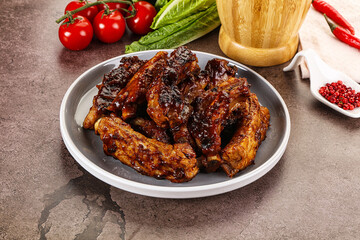 Grilled pork ribs in barbecue sauce
