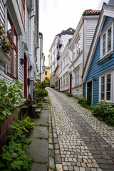 Obraz premium Charming alleyway with cobblestone path in old town in Bergen, Norway