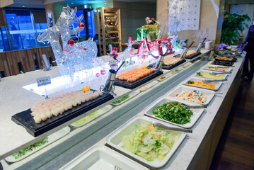 Korean buffet meal salad sushi dumpling fruit vegetable meat