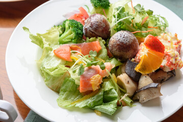 Korean buffet meal salad sushi dumpling fruit vegetable meat