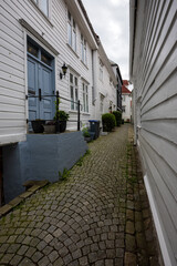 Charming old town alley with cobblestone path in Bergen, Norway