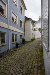 Charming old town alley with cobblestone path in Bergen, Norway