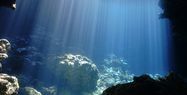 Underwater photo of rays of sunlight inside a cave. From a scuba dive in Thailand.