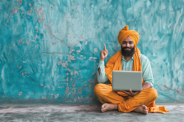 Fototapeta premium young indian man using laptop and pointing