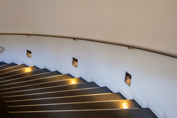 Illuminated Modern Staircase with Curved Design