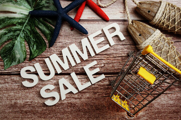 Summer Sale promotion decoration with nautical marine ornament on wooden background