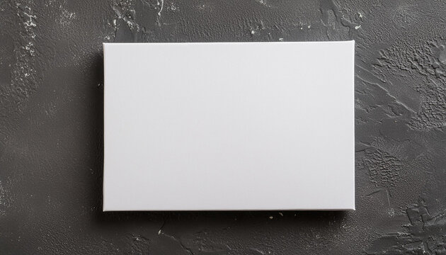 Blank rectangular white poster on dark gray surface, mock-up for design presentations and portfolios