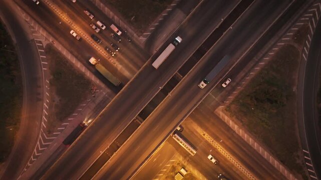 Drone footage scenic landscape of the traffic at bridge over the intersection in the rural place