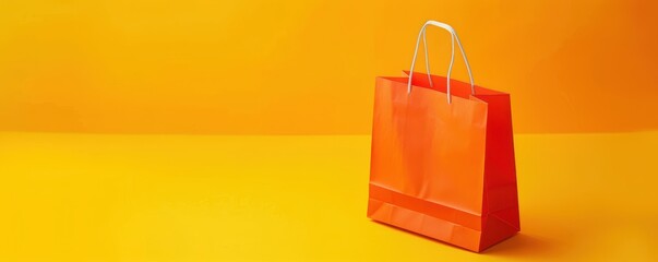 A yellow background with a shopping bag and leaves. Free copy space for text.