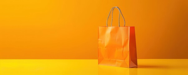 A yellow background with a shopping bag and leaves. Free copy space for text.