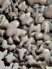 Obraz premium cookie cutters of various shapes made of stainless steel cut the dough into the desired shapes. baking advertising cookbook or sweet food factory for Christmas, car, truck, dinosaur