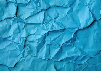 Obraz premium crumpled blue paper texture background