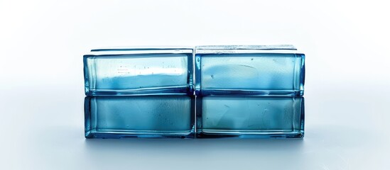 Colored blue glass brick block. Traditional and non-traditional construction, materials to decorate walls. House foundations and structures. Hardware, masonry, home architecture isolated on white