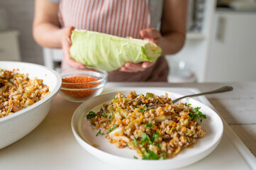 Homemade food. Fried brown rice with red lentils and cabbage