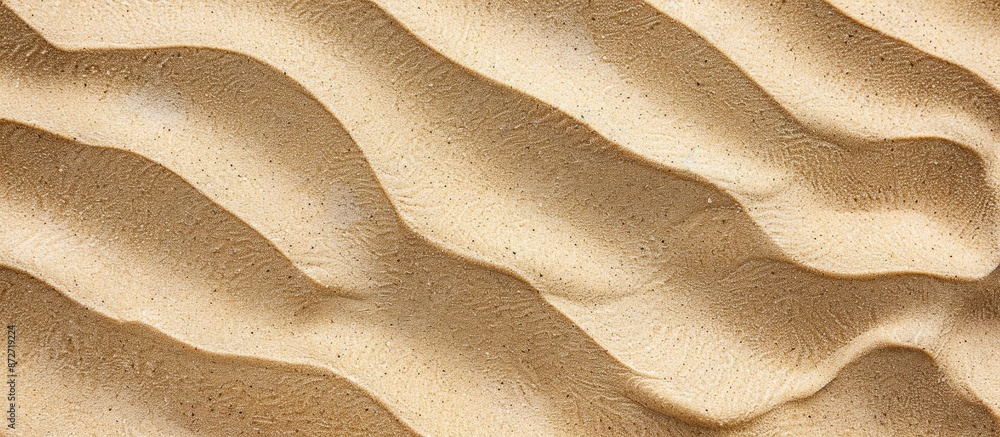 Poster Close-up view of natural beach sand texture with wavy ground, creating a background, seen from the top with copy space image.