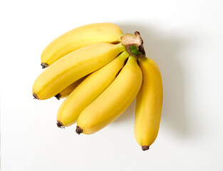 Fresh yellow bananas isoalted on white background. Top view.