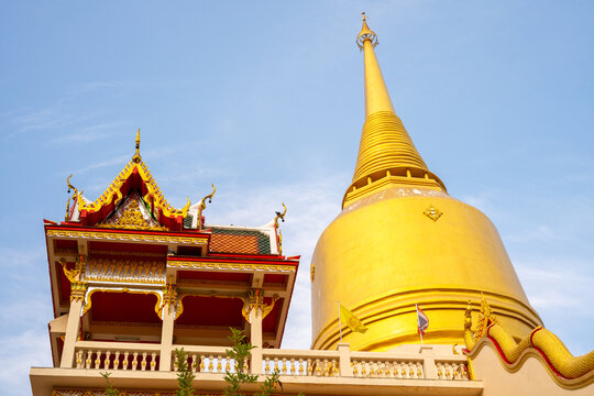 The Vipassana meditation building with a yellow bell-shaped pagoda at Wat Pai Luang is considered a beautiful building with a Naga staircase leading up to it, which can be seen from afar and looks bea