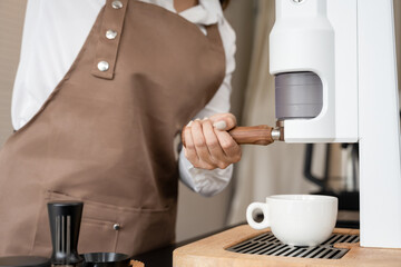 Barista making a cup of coffee at the coffee shop