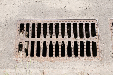 stormwater drain on the street in sunny day